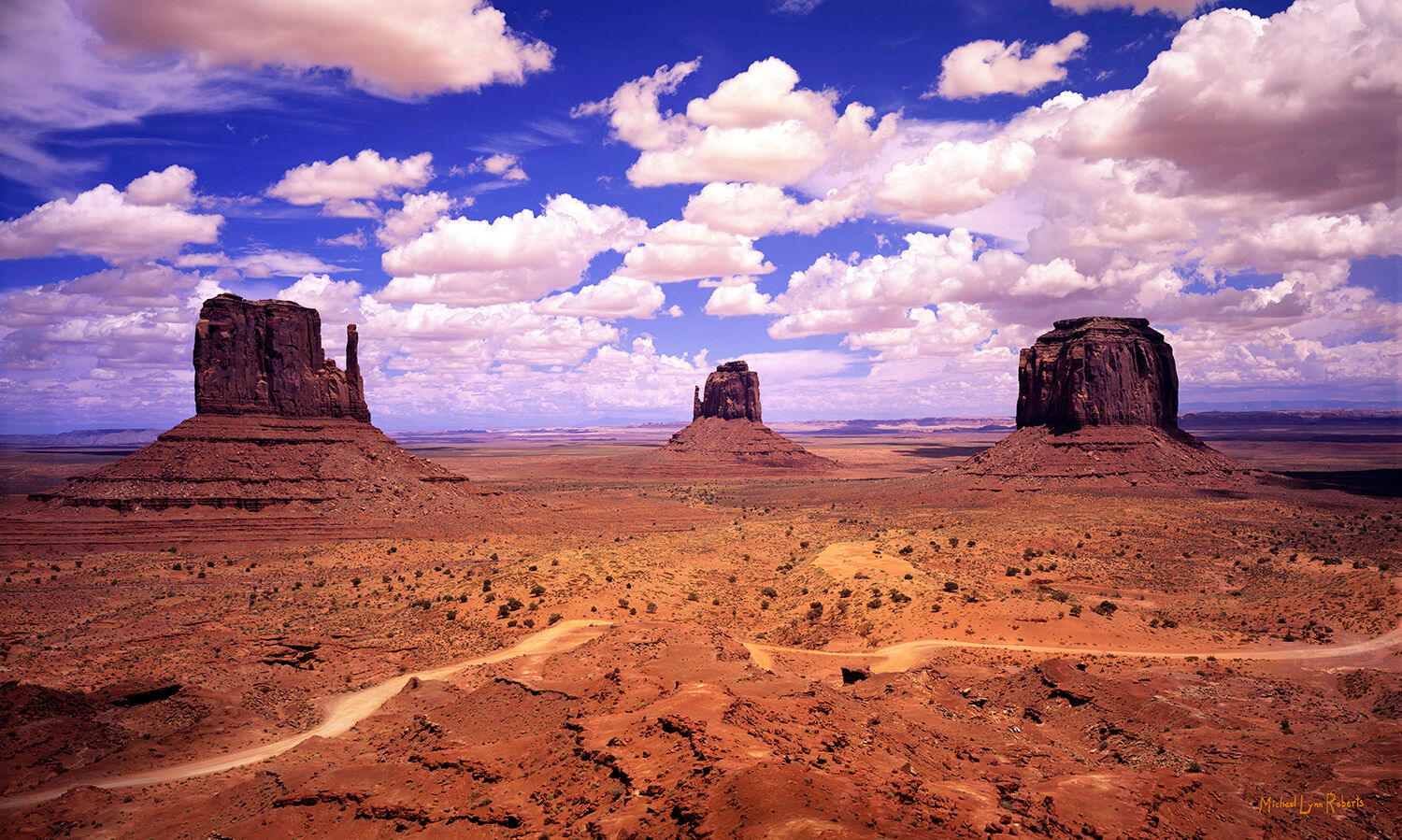 To me, this is the classic view of Monument Valley from the rim overlook. All three of the closest buttes are grouped together...