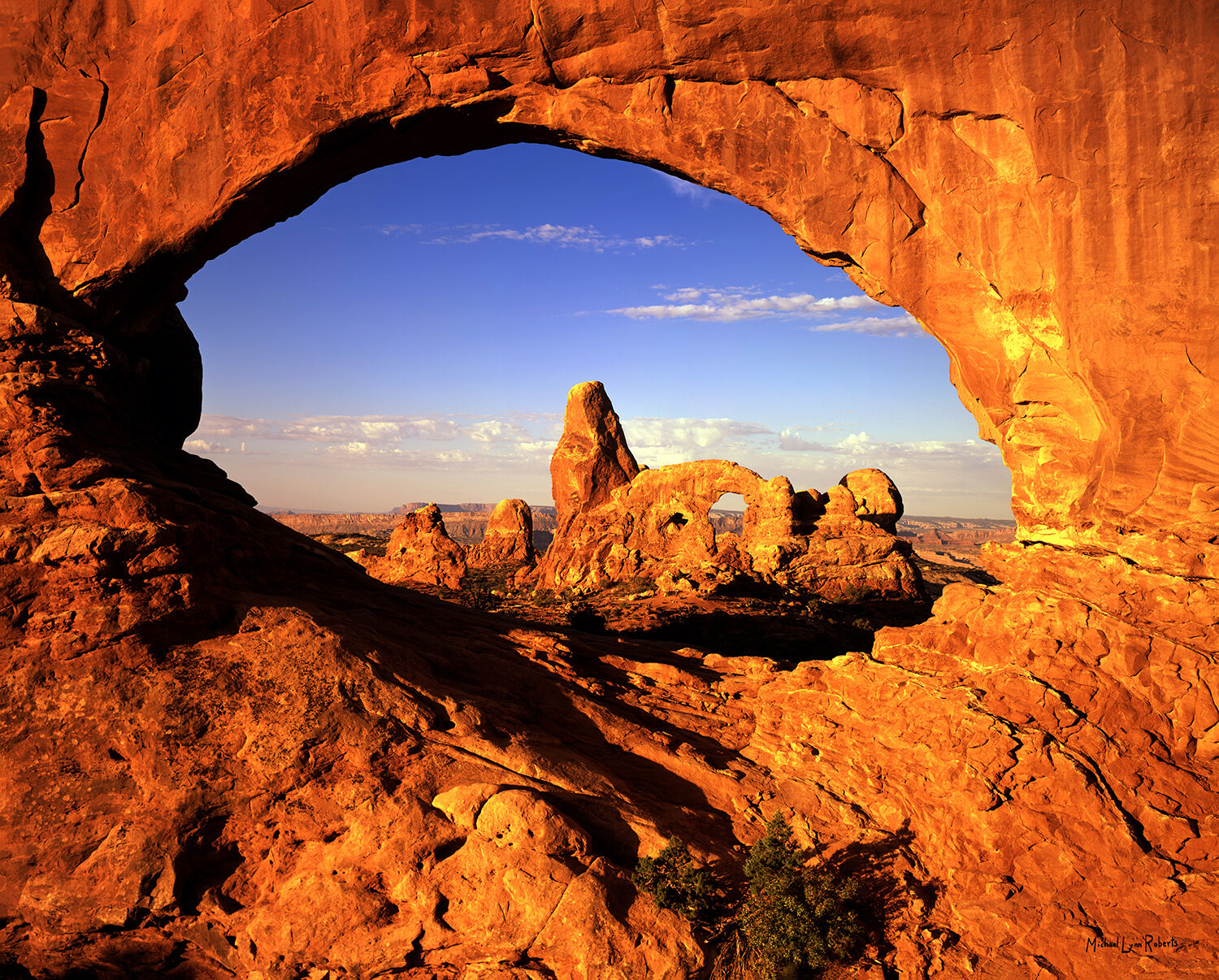 This is a photograph of Turret Arch, as seen through the east side of North Window Arch in the Windows section of Arches National...