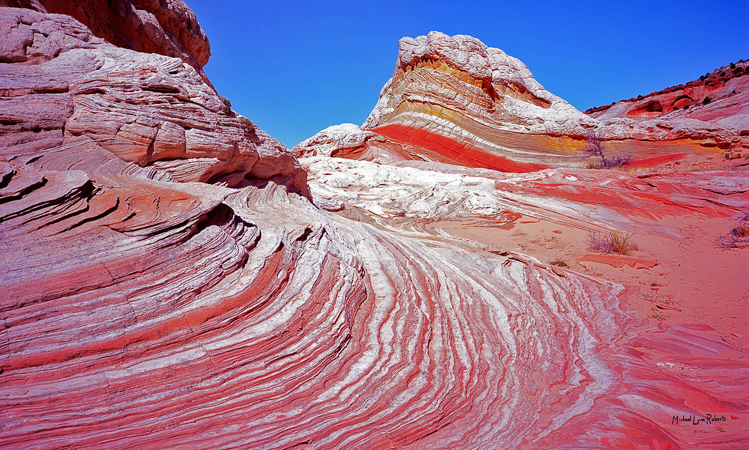 The White Pocket, on the Utah/Arizona border in the Vermillion Cliffs Wilderness Area, is a fantastically colorful and surreal...