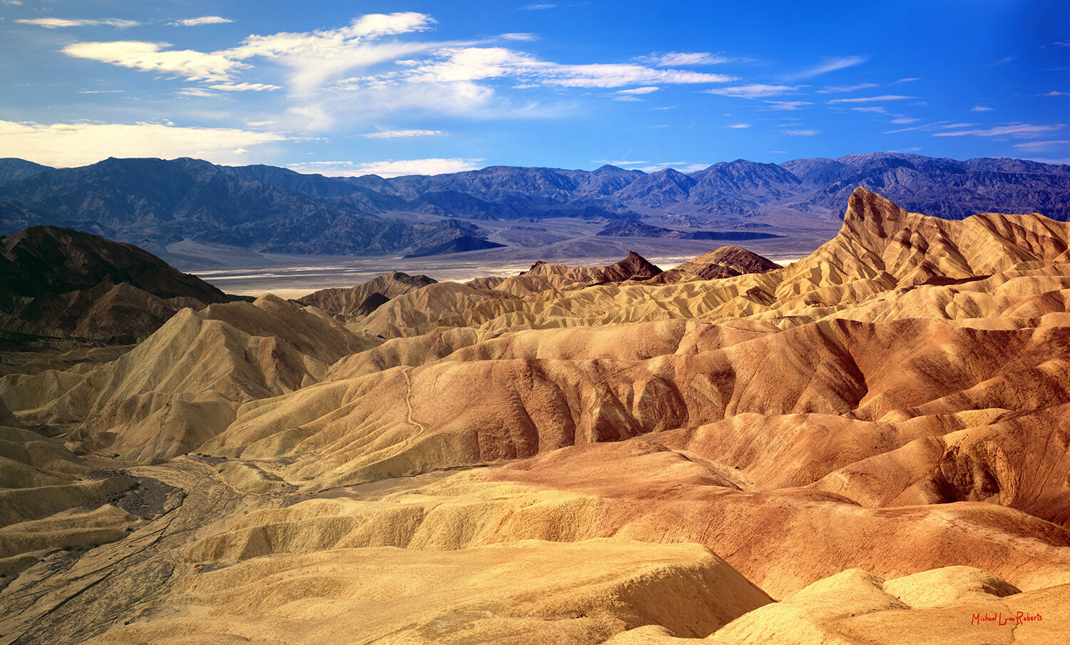 This view of Death Valley from the high overlook of Zabriskie Point is a classic scenic view of the American West. The colorful...